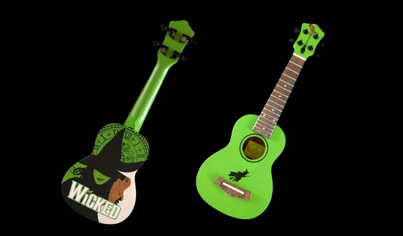 Lime green uke with a witch painted on the front and back