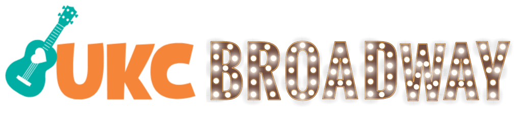 A green ukulele with the words "UKC Broadway" to the right